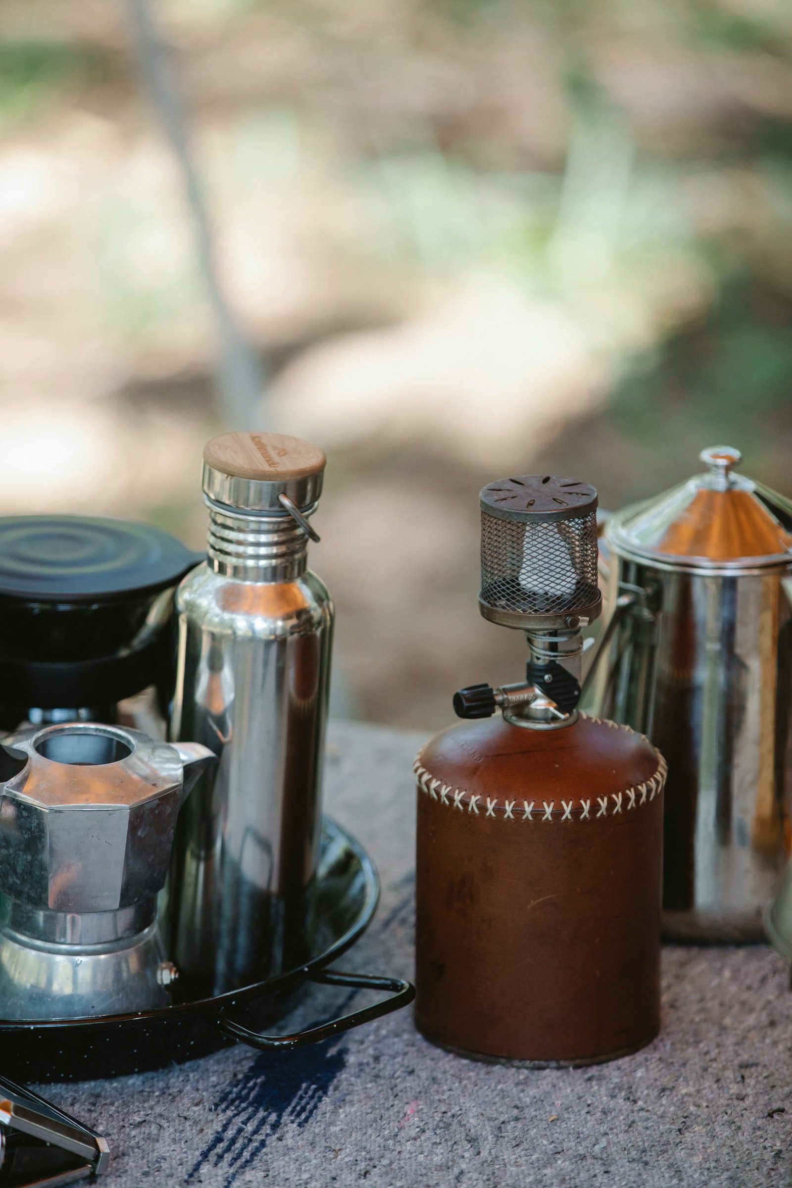 Portable camp stove with teapots and thermos
