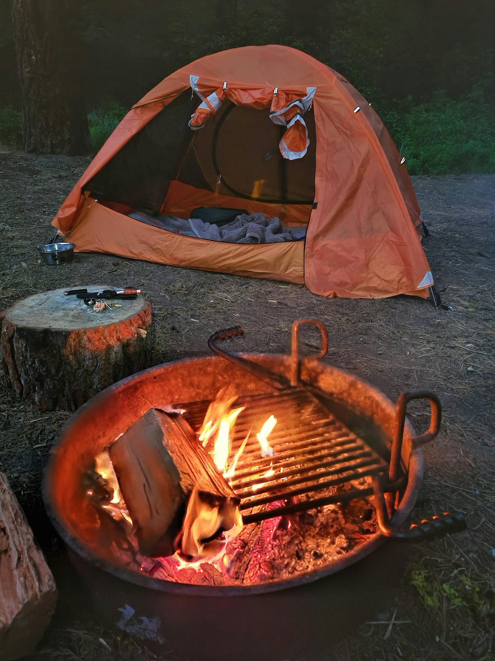 Tent and campfire at twilight